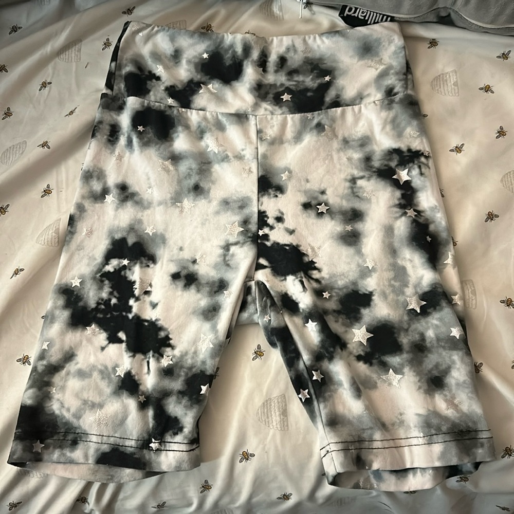 Justice, size xs, and is black white with stars